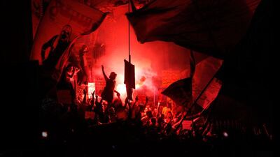 Members of Egypt's Youth Movement shout anti-Muslim Brotherhood slogans and light flares during a rally in front of the prosecutor general's office in Cairo, Egypt. Amr Nabil / AP Photo
