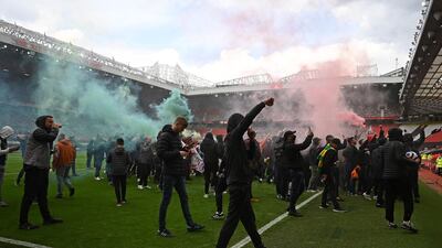 Supporters protest against Manchester United's owners - the Glazer family - inside Old Trafford. AFP