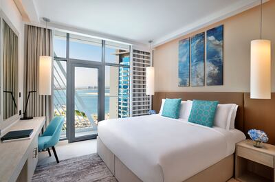 Rooms have simple, clean interiors and many offer sea-facing views. Photo: NH Collection