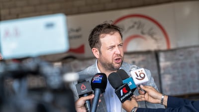 Stephen Doughty, UK Minister of State for the Middle East and North Africa, speaks to media inside aid warehouses designated for Gaza alongside the Egyptian Red Crescent near the Rafah border crossing. Getty