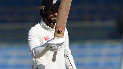 New Zealand's Tom Blundell celebrates after reaching his fifty at the National Stadium in Karachi. AFP
