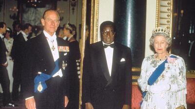 Robert Mugabe with Britain's Queen Elizabeth II and Prince Philip. Shutterstock