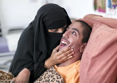 Alya with her son Abdulrahman, 18, at her home in Abu Dhabi. Reem Mohammed / The National