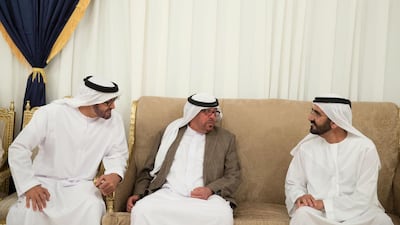 Sheikh Mohammed bin Zayed, Crown Prince of Abu Dhabi, left, and Sheikh Mohammed bin Rashid, Vice President and Ruler of Dubai, right, offers condolences to Khalaf Al Otaiba on the passing of Almurr bin Khalaf Al Otaiba. Mohamed Al Hammadi / Crown Prince Court - Abu Dhabi