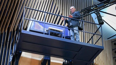 To reach the keys, pianists face a long uphill climb up a steep flight of steel stairs. AFP