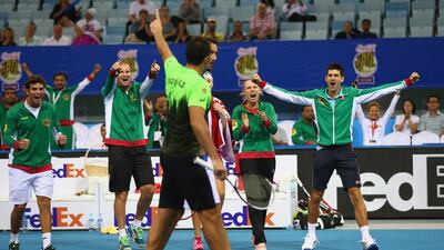 From right, Novak Djokovic and Caroline Wozniacki celebrate as teammates Nenad Zimonjic and Marin Cilic seal the win for UAE Royals. Clive Brunskill / Getty Images