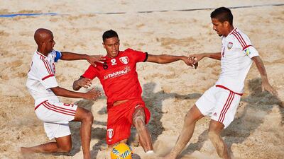 Tahiti, in red, beat the UAE 7-3 in their second Group A match at the Beach Soccer Intercontinental Cup at Dubai Marina. Courtesy Lea Weil / Beachsoccer.com