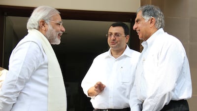 Mr Tata and his successor as Tata chairman, Cyrus Mistry, with Mr Modi in Gandhinagar near Ahmedabad in 2014. AFP