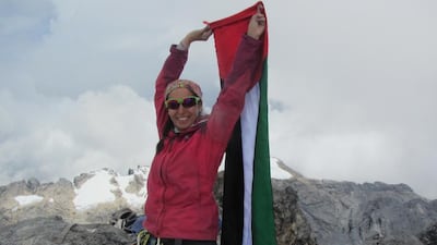 Suzanne Al Houby carried her nation’s colours to the top of Cartstensz, Indonesia, the highest summit of Oceania. Courtesy Suzanne Al Houby