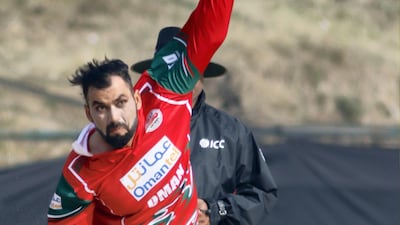 Bilal Khan of Oman bowls during the World Cup League two match against Nepal. Subas Humagain for The National