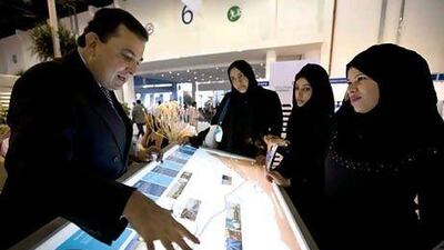 Visitors at Dolphin Energy's booth during ADIPEC 2008. Dubai receives some of its gas from Doha through the Dolphin pipeline. Jaime Puebla / The National