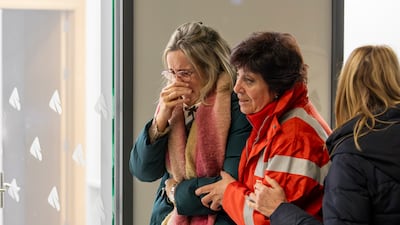 Relatives of victims arrive at Huelva train station seeking information. EPA