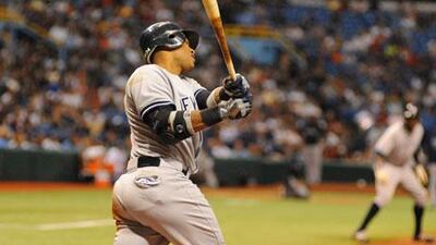 Robinson Caro hits for the New York Yankees against Tampa Bay