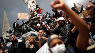 People attend a protest against police brutality and the death in Minneapolis police custody of George Floyd, in Nantes, France, June 8, 2020. REUTERS/Stephane Mahe TPX IMAGES OF THE DAY - RC235H9VE8PJ