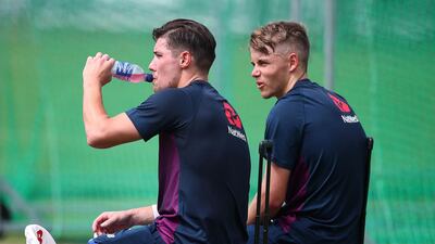 Sam Curran and Olly Burns of England look on during previews. Getty Images
