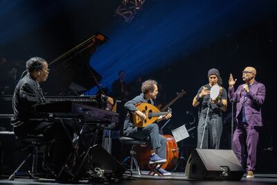 From left, Herbie Hancock, Naseer Shamma and Rhani Krija with fellow artists on stage at Etihad Arena. Ryan Lim for The National