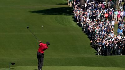 Woods hits his tee shot on the third hole during the final round at the Masters. AP