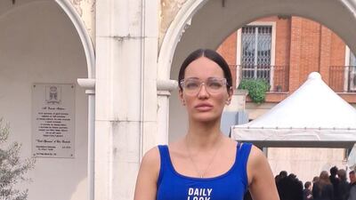 upgrading a silver tracksuit outside the Genny show