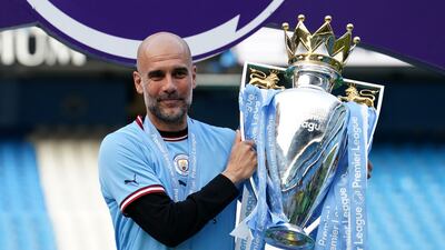 Manchester City manager Pep Guardiola, pictured holding the Premier League trophy, the club's fifth in six seasons. PA