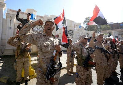 Houthi soldiers chant slogans during a parade in Yemen. EPA