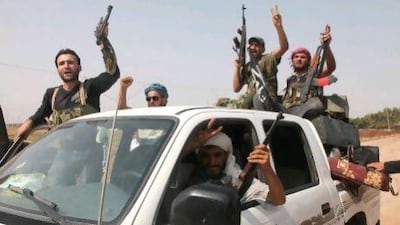 Syrian rebel fighters celebrate after capturing a checkpoint in the village of Anadan, about five kilometres northwest of Aleppo after a 10-hour battle. Nevertheless, they are overwhelmingly outgunned by the Syrian military with its tanks and helicopters.