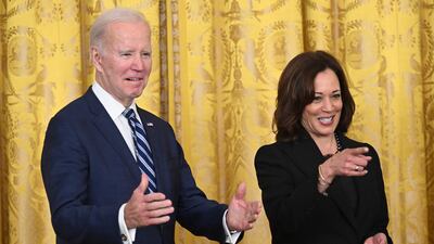 Mr Biden and Ms Harris gesture at the reception celebrating Black History Month. AFP