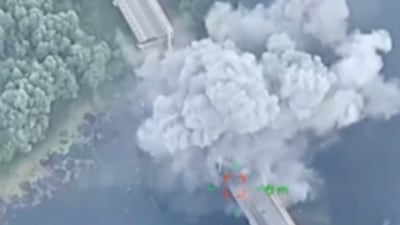 The moment a Ukrainian strike hits a bridge over the Seym River in the Glushkovo district of western Russia's Kursk region. Reuters