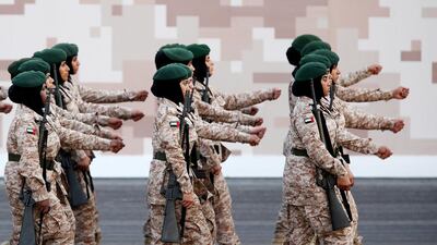 Female soldiers parade.