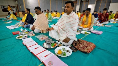 Indian businessmen pray in front of their record-keeping books as part of a ritual to worship the Hindu deity of wealth goddess Lakshmi in Ahmedabad, India. Reuters