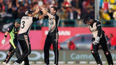 Mitchell Santner took two wickets in New Zealand's victory over Australia at Dharamsala on Friday. Tsering Topgyal / AP Photo