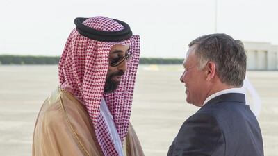 Sheikh Tahnoon bin Zayed Al Nahyan, UAE National Security Advisor (L), greets HM King Abdullah II bin Al-Hussein of Jordan (R), at the Presidential Airport. Ryan Carter / Crown Prince Court - Abu Dhabi