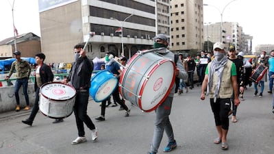 Iraqi protesters beat on the drums during a protest at the Al-khilani square in central Baghdad, Iraq. EPA