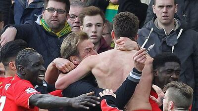 Liverpool manager Jurgen Klopp celebrates with Adam Lallana on Saturday after he scored the winner in their 5-4 Premier League victory. Lindsey Parnaby / AFP / January 23, 2016