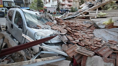 A damaged vehicle lies under the rubble of a collapsed building after an earthquake in Sindirgi in the western Balikesir province, Turkey, August 11, 2025. REUTERS / Efekan Akyuz TPX IMAGES OF THE DAY