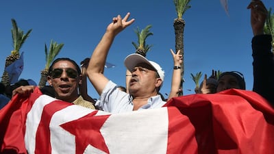 Supporters of Nidaa Tounes (Call for Tunisia) stage a demonstration ahead of the parliamentary election in the coastal city of Hammam Lif, south of Tunis, on October 21. Fethi Belaid / AFP