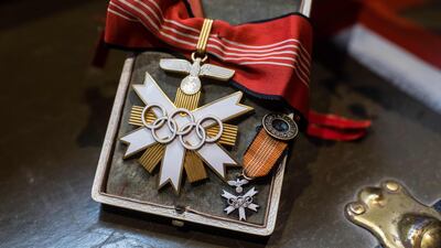 A first-class badge of honour from the 1936 Olympic Games is pictured on November 20, 2019, at the Hermann Historica auction house near Munich. AFP