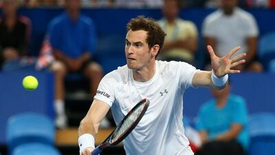 Andy Murray of Great Britain, partnered with Heather Watson plays a backhand in the mixed doubles match against Caroline Garcia and Kenny De Schepper of France during Day 2 of the 2016 Hopman Cup at Perth Arena on January 4, 2016 in Perth, Australia. (Photo by Paul Kane/Getty Images)