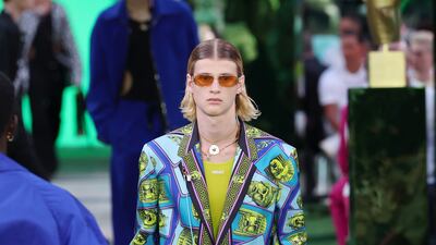 This spring/summer 2023 look by Versace is covered in drawings of classical faces. Getty Images