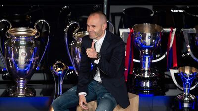 Barcelona's Spanish midfielder and captain Andres Iniesta gives a thumbs-up during a tribute at the Camp Nou. Josep Lago / AFP