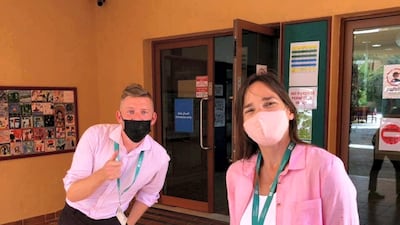 Mark Ryan, head of specialists at Raha International School, and Lise Farquhar, an art teacher at the school, wore pink on Thursday. Courtesy: Mark Rya