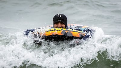 A man swims in the sea near Scarborough. PA