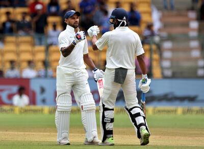 India's Murali Vijay, right, and Shikhar Dhawan, left, both scored centuries against Afghanistan. Aijaz Rahi / AP Photo