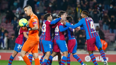 Barcelona's Nico Gonzalez, third from right, celebrates with his teammates after scoring his side's third goal. AP