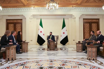 Syria's interim President Ahmad Al Shara receives German Foreign Minister Annalena Baerbock, third left, in Damascus on Thursday. Sana / AFP