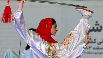 An Iranian woman competes in a taijiquan competition in Tehran. AFP