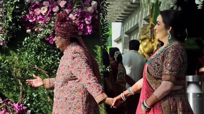 Reliance Industries Chairman Mukesh Ambani and his wife Nita Ambani welcome guests during the wedding of their son Akash Ambani in Mumbai, India, Saturday, March 9, 2019. Photo: AP
