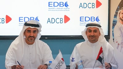 ADCB executive Saoud Al Jassem, left, and Shaker Zainal of EDB during the signing ceremony. Photo: EDB
