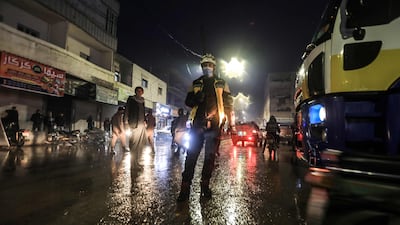 A member of the Syrian Civil Defence at the scene of the explosion at the market in the Turkish-controlled city of Al Bab, in Syria's Aleppo province. AFP