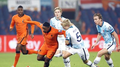 Steven Bergwijn of Netherlands and Birger Solberg Meling of Norway in action. EPA