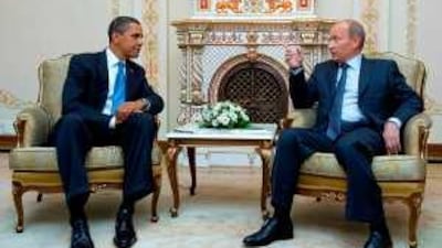 Barack Obama and Vladimir Putin chat at the Russian prime minister's summer home near Moscow.